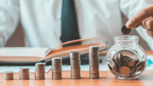 Man saving coins to reduce their health costs